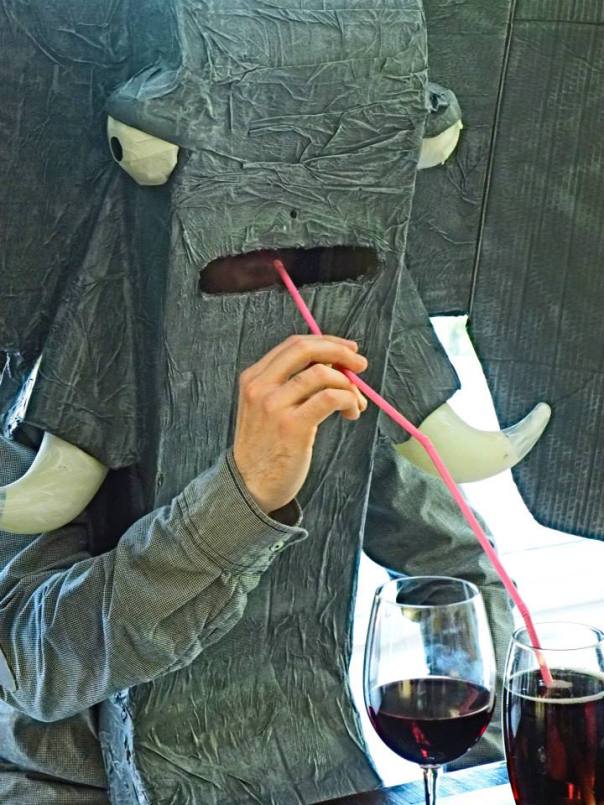 Me dressed as an elephant, drinking from several conjoined straws.